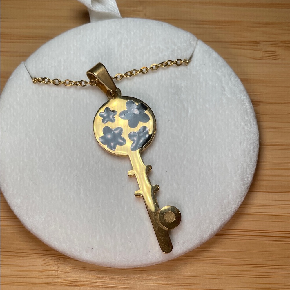 Gold Key Pendant Necklace with Floral Design